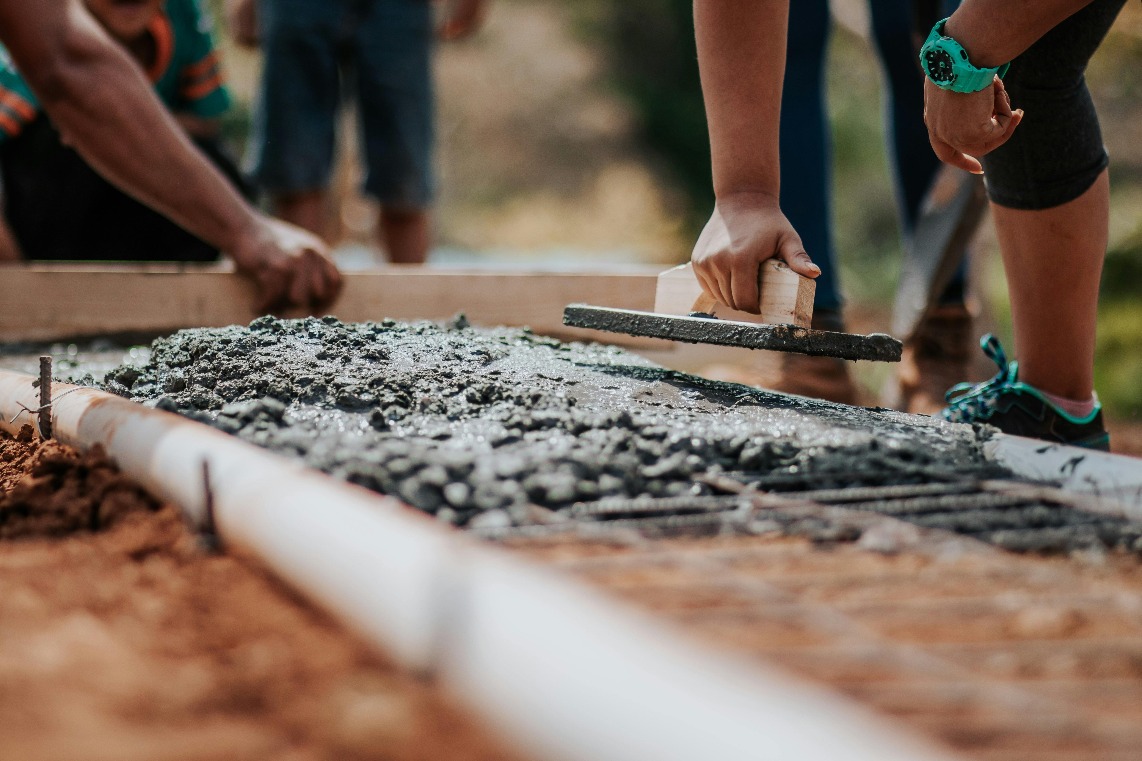 People Laying Concrete