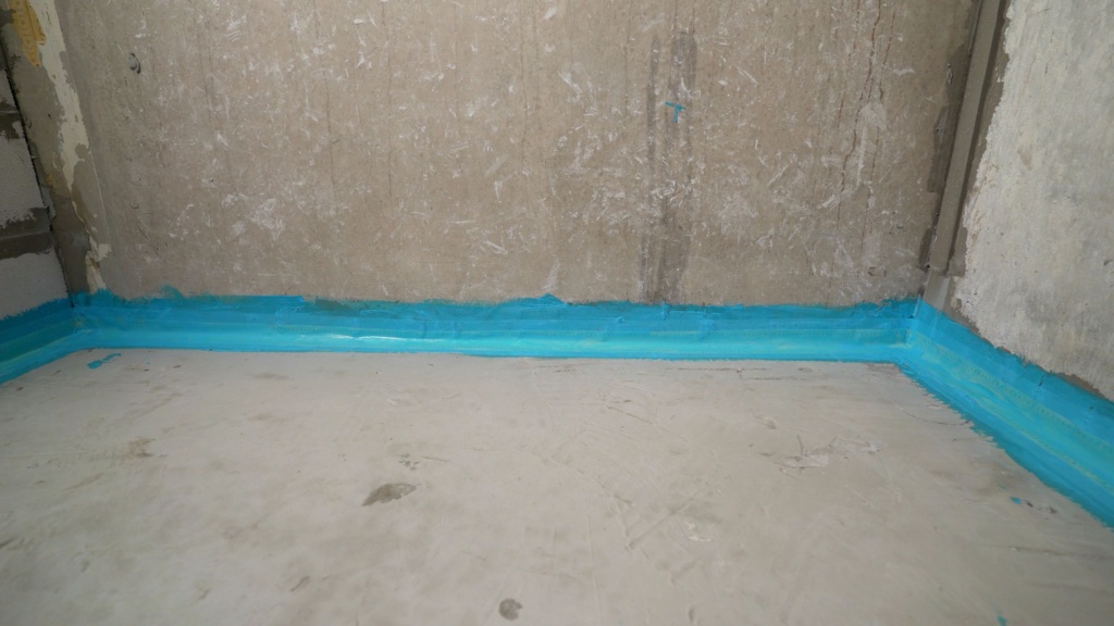 Working Brush For Waterproofing Walls And Floors. Blue Waterproofing. Waterproofing The Floor With Blue Mortar